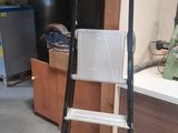 a ladder that is sitting in a garage