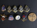 a lot of badges that are on a black surface