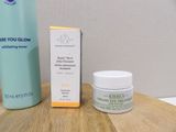 a bottle of eye cream and a box of eye cream on a table