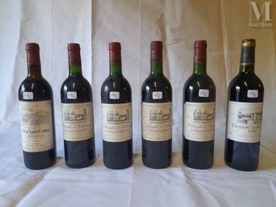 six bottles of wine are lined up in a row on a table