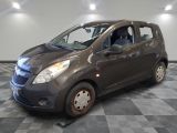 a picture of a small car parked in a garage