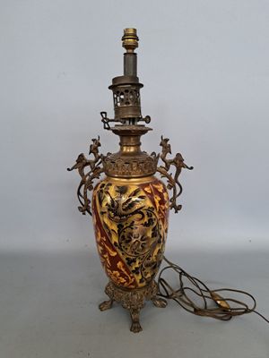 a lamp that is sitting on a table next to a wall