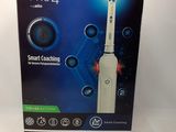 the box of the electric toothbrush is open and ready to use