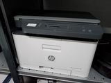 a printer that is sitting on top of a shelf