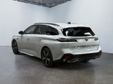 the rear of a white car in a white room with a black floor