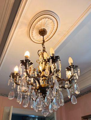 a chandelier hanging from the ceiling in a room