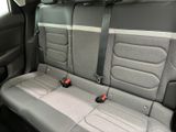 two seats in the back of a car that are empty