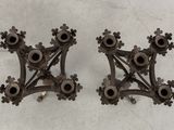 two pieces of metal that are on a table