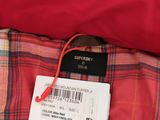 a close up of a red shirt with a tag on it
