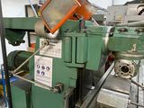 an image of a machine that is working on a piece of metal