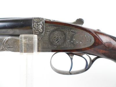 an old gun that is sitting on top of a table