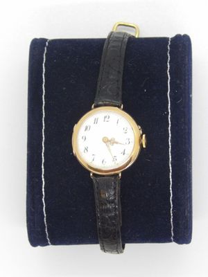 a watch that is sitting on top of a velvet case