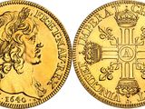 an image of a gold sovereign coin with a cross on it