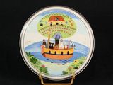 a plate with a picture of a boat with animals on it