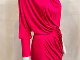 the mannequin is wearing a bright pink dress with a cow neck