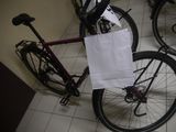 a bike that has a bag on the back of it