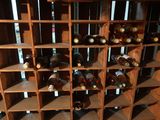 a wine rack with many bottles of wine in it