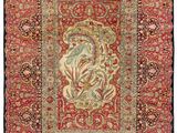 tapis persan ancien à motif floral sur fond rouge