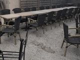 many chairs and tables on the patio of a restaurant