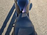 a motorcycle that is parked on the side of the road