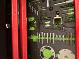 a red tool box with a bunch of tools inside of it