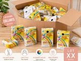 a box filled with lots of candy sitting on top of a wooden table