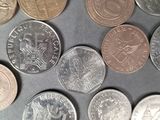 a lot of coins that are on the table