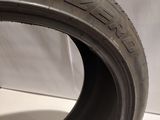 a close up of a tire on a white surface with a white background