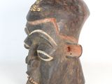 an image of a wooden sculpture of a man ' s face on a white background