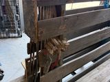 a bench made out of wood that is sitting in a garage