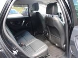a view of the inside of a car from the driver ' s seat