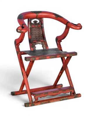 a red chair with a black seat on a white background