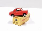 a red toy car sitting on top of a box