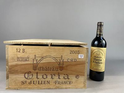a wooden box with a bottle of wine next to it