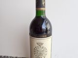 a bottle of wine that is sitting on a table