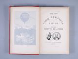 an open book with a picture of a hot air balloon in the background