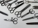 many different types of scissors on the table