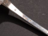 a close up of a hammer on a black surface