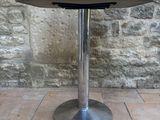 a small table with a book on top of it