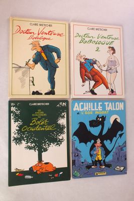 quatre livres pour enfants sont alignés sur une surface blanche