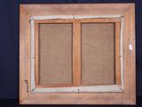 an old picture frame with a picture of a couple of windows in it