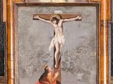 an image of a painting of jesus on the cross with a woman kneeling on the ground