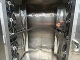 a large metal box with a bunch of wheels inside of it