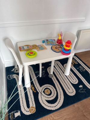a small table with a toy train set on it