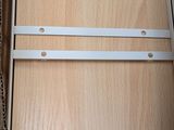 a picture of a box with a pair of metal brackets