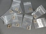 five small clear bags with gold rings on them