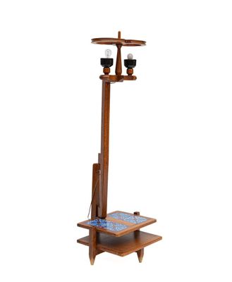 an image of a wooden coat rack with two candles on it