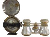 a clock and a pair of salt and pepper shakers on a stand