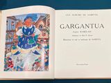 an open book with a picture of a girl in a blue dress
