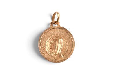 a close up of a gold medal on a white background